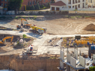 Aerial view of construction site, construction of new building in residential area.