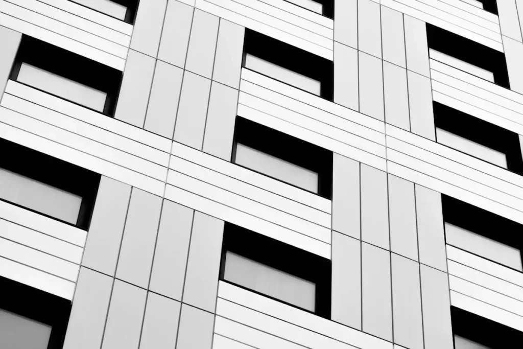 Close-up of a modern building facade with rows of windows